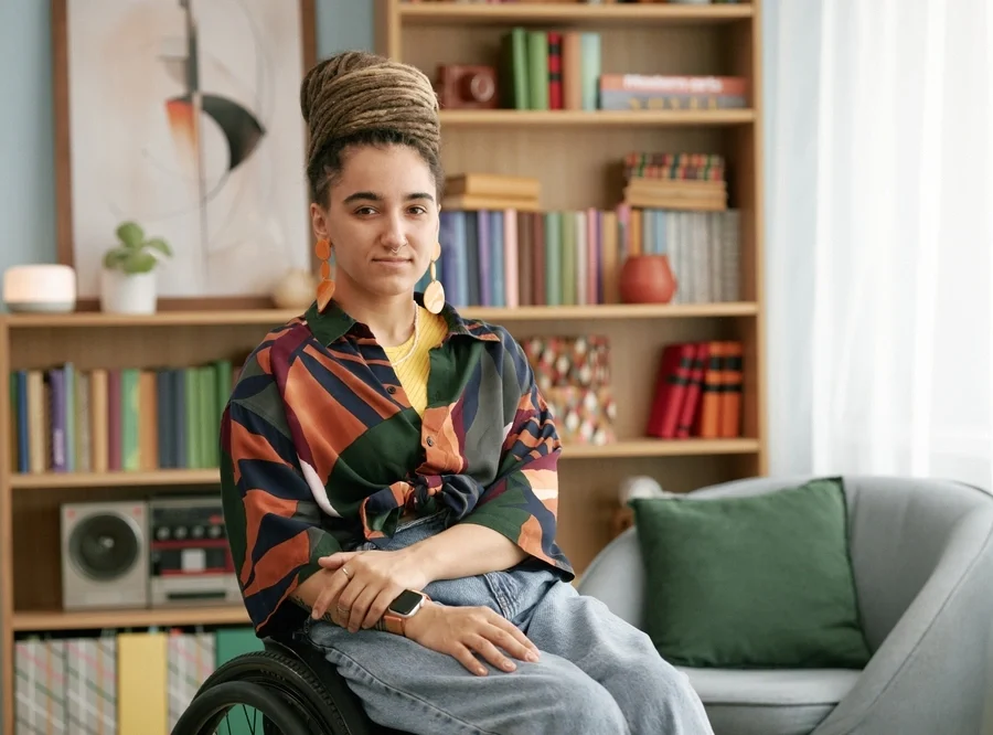 portrait of a disabled women on wheelchair in her home